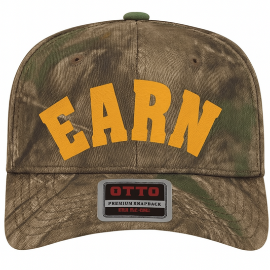 Camouflage cap with 'EARN' in yellow and Otto logo on a white background